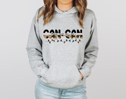 A woman wearing a grey hoodie with the text "GANTZ" printed on it.