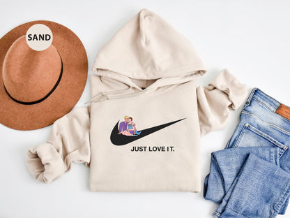 a hat, sweatshirt, jeans, and a pair of shoes on a white surface