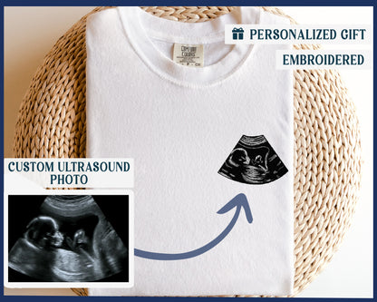 a t - shirt with a picture of a baby in a diaper