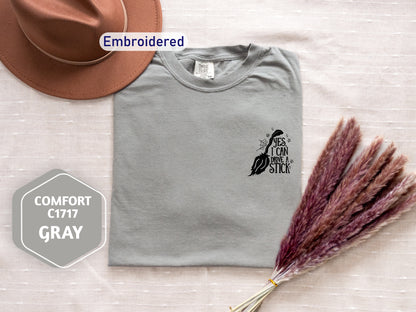 a hat, t - shirt, and dried grass on a bed