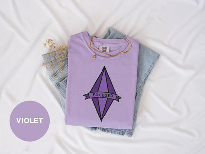 a purple t - shirt with the word rocket on it next to a pair of