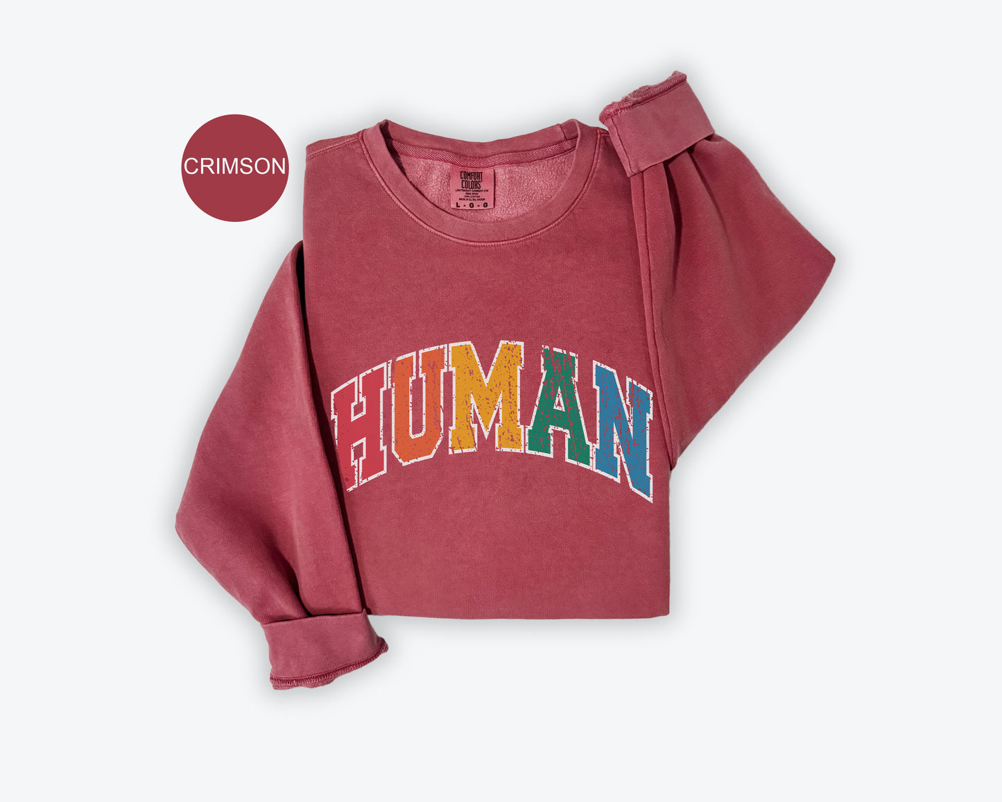 a pink shirt with the word human printed on it