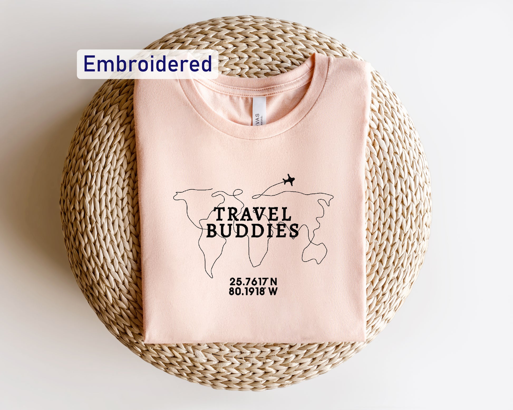 a pink t - shirt with the words travel buddies printed on it