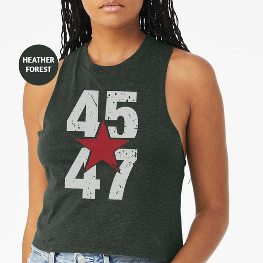 a woman wearing a tank top with the number 477 on it