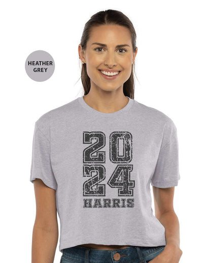 a woman wearing a gray shirt with the number twenty twenty twenty twenty twenty twenty twenty