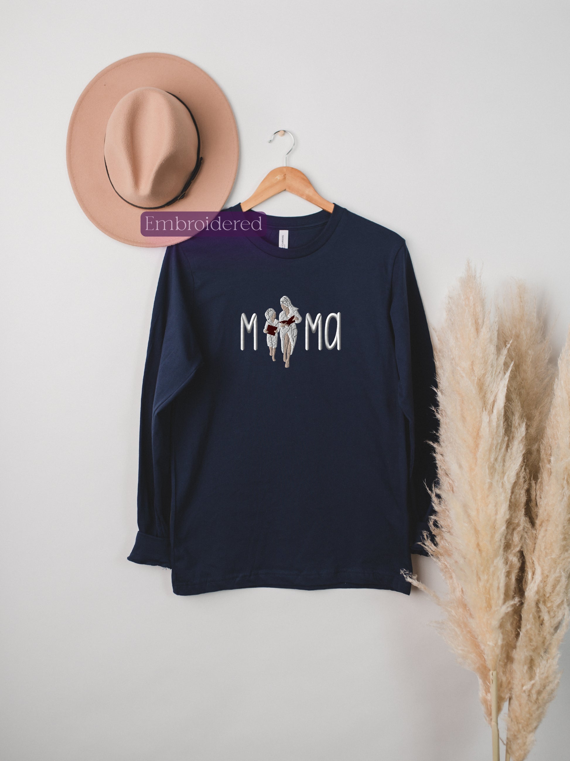 a hat, a t - shirt, and a feather on a white background