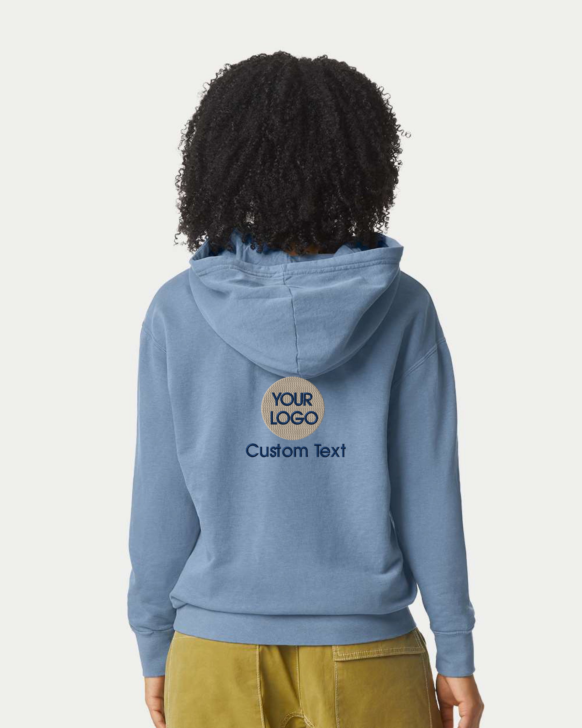 a woman wearing a blue hoodie with a custom text