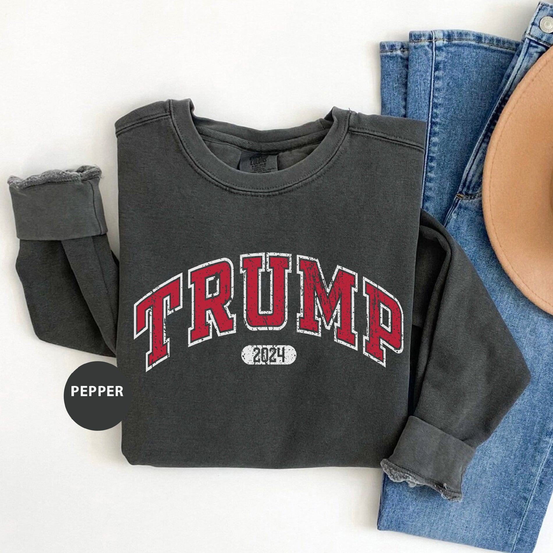 a black shirt with the word trump printed on it