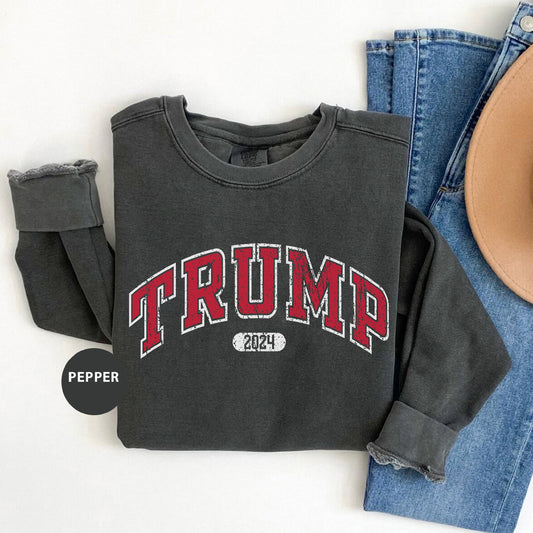 a black shirt with the word trump printed on it