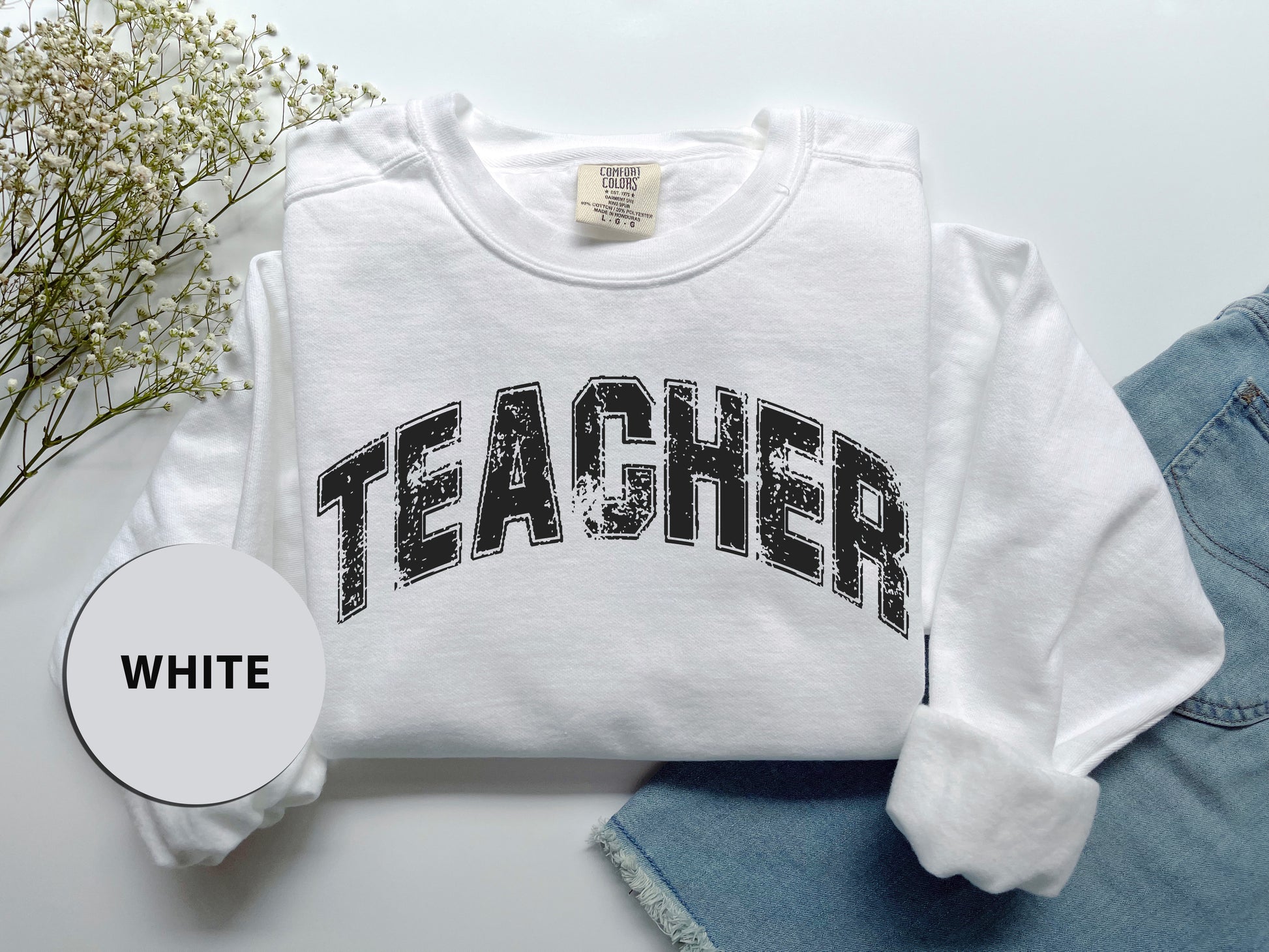 a t - shirt with the word teacher printed on it