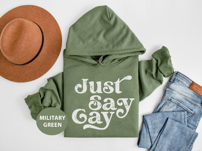 a green hoodie with just say gay written on it