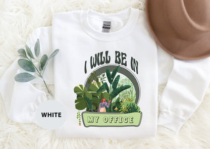 a t - shirt with a picture of a woman in a garden on it