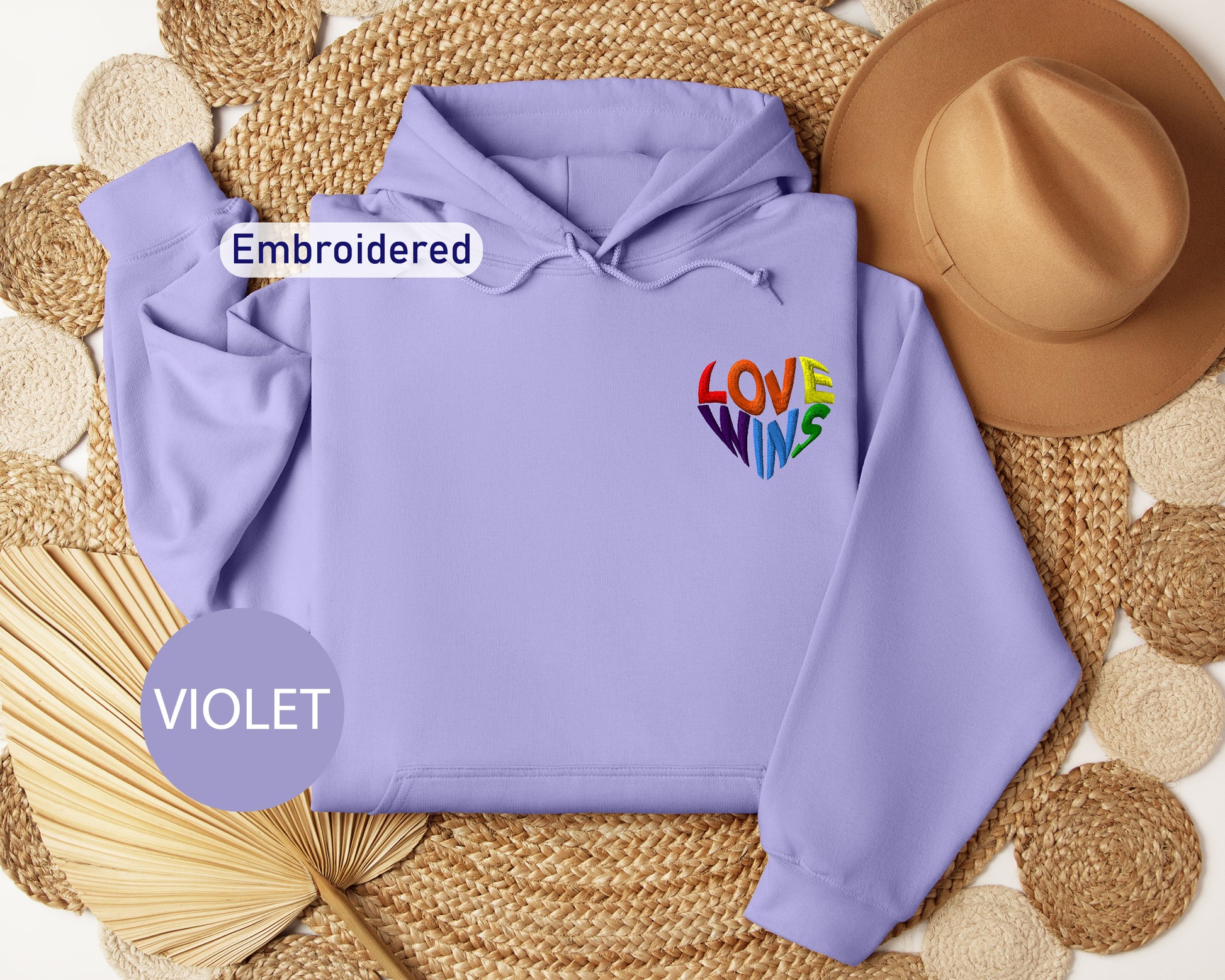 a purple hoodie with the word love written on it