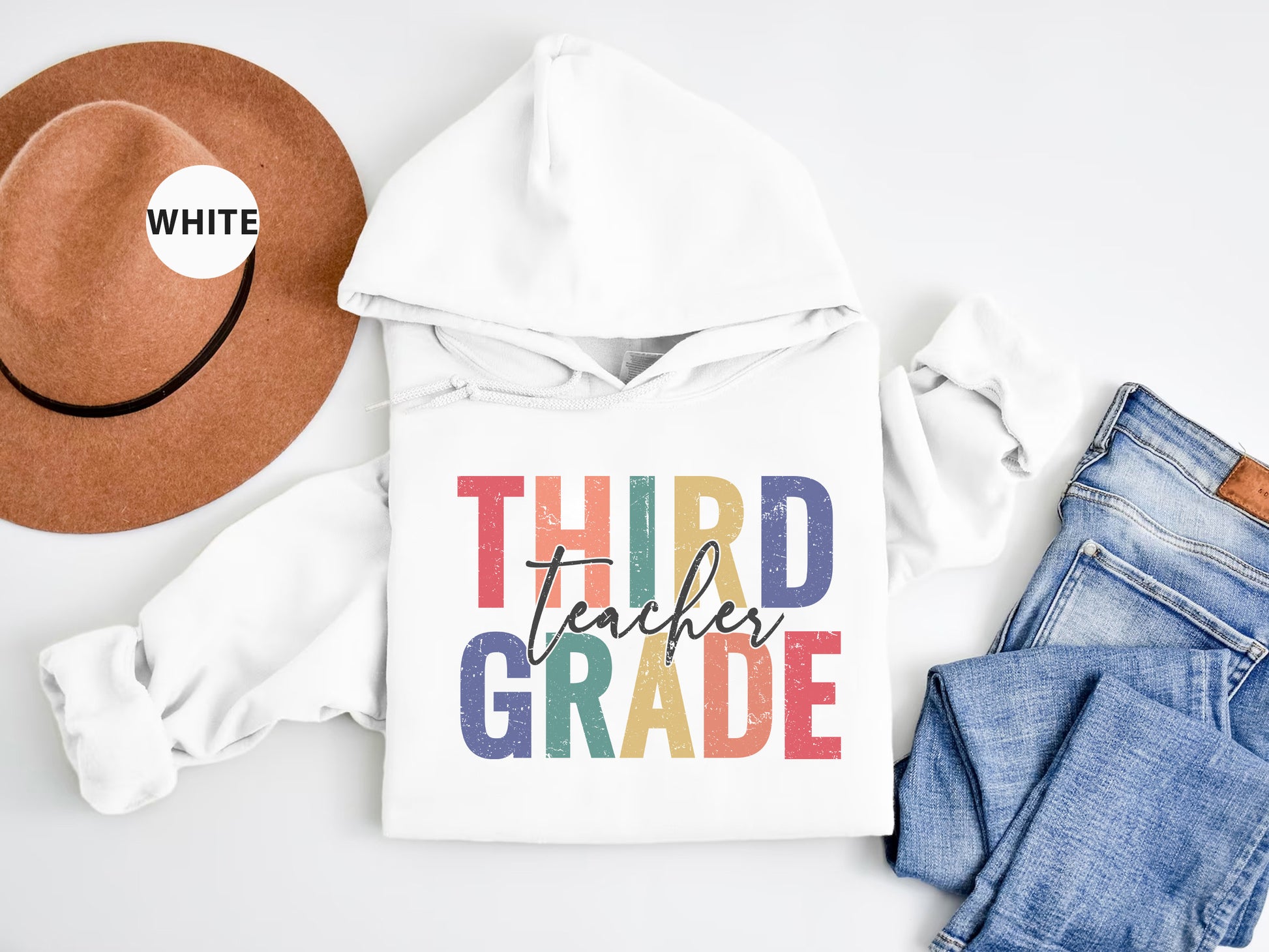 a white hoodie with the words third grade printed on it