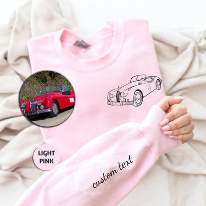 a pink shirt with a car drawn on it