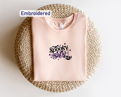 a pink t - shirt with the words spooky girl on it