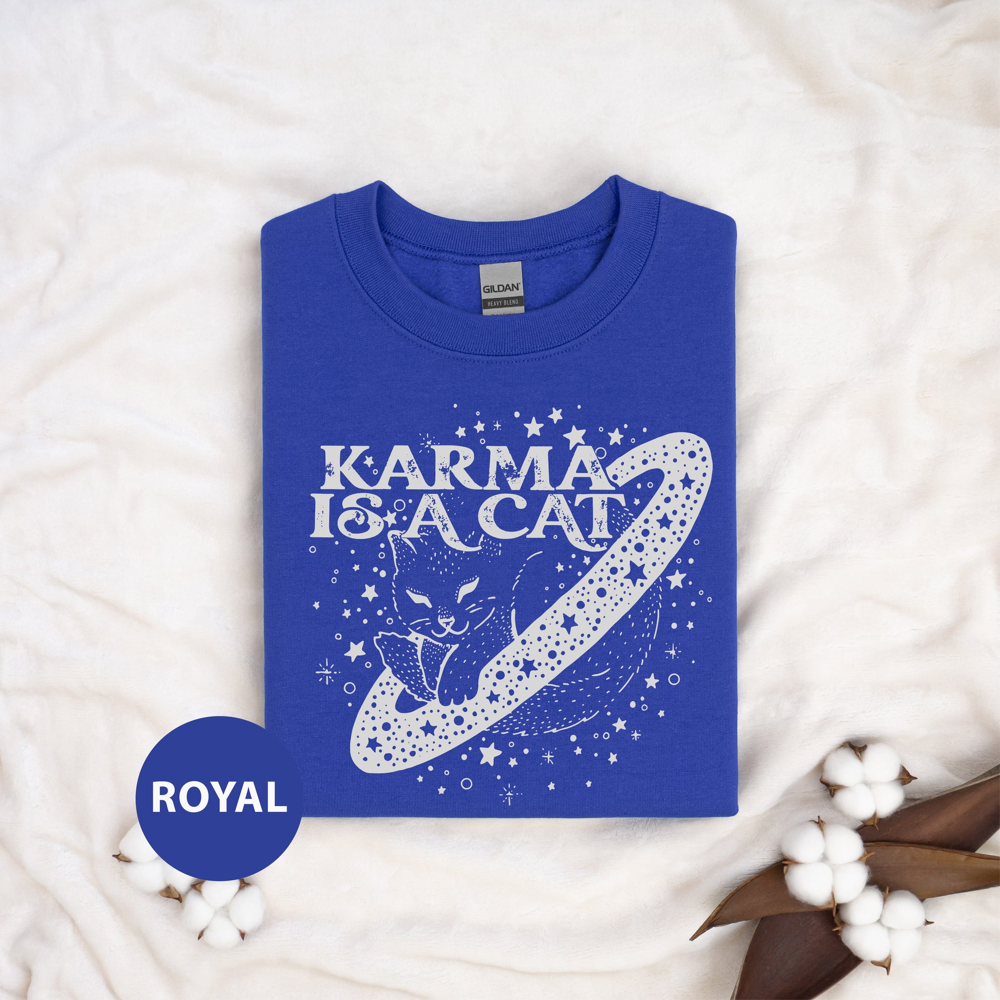 a blue t - shirt with the words karma is a cat on it