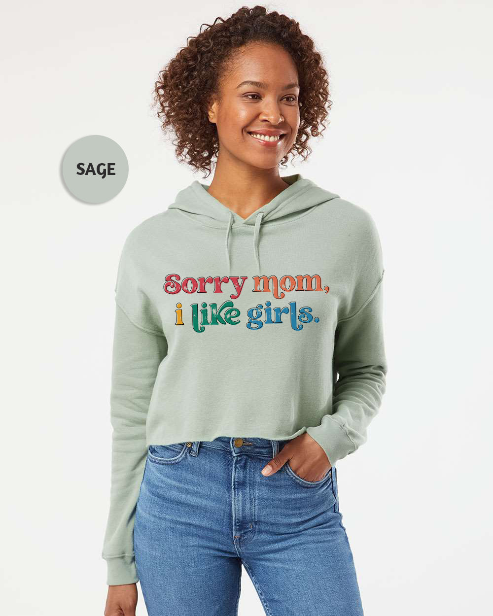 a woman wearing a green hoodie that says sorry mom i like girls