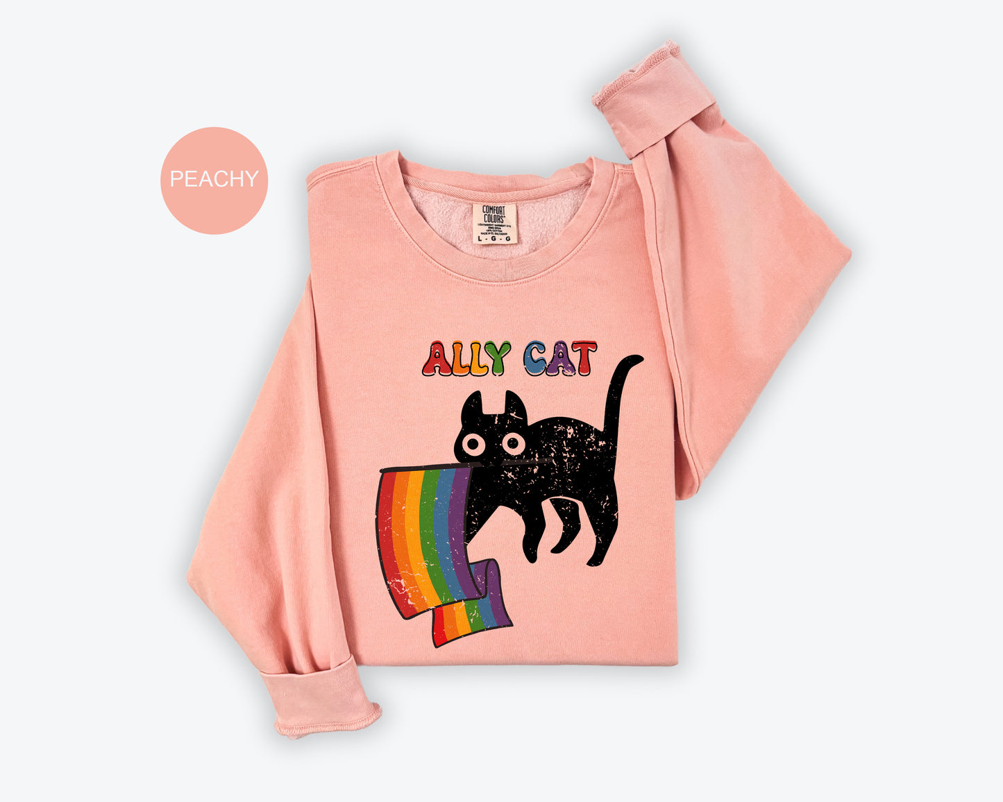 a pink shirt with a black cat on it