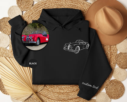 a black hoodie with a picture of a red car