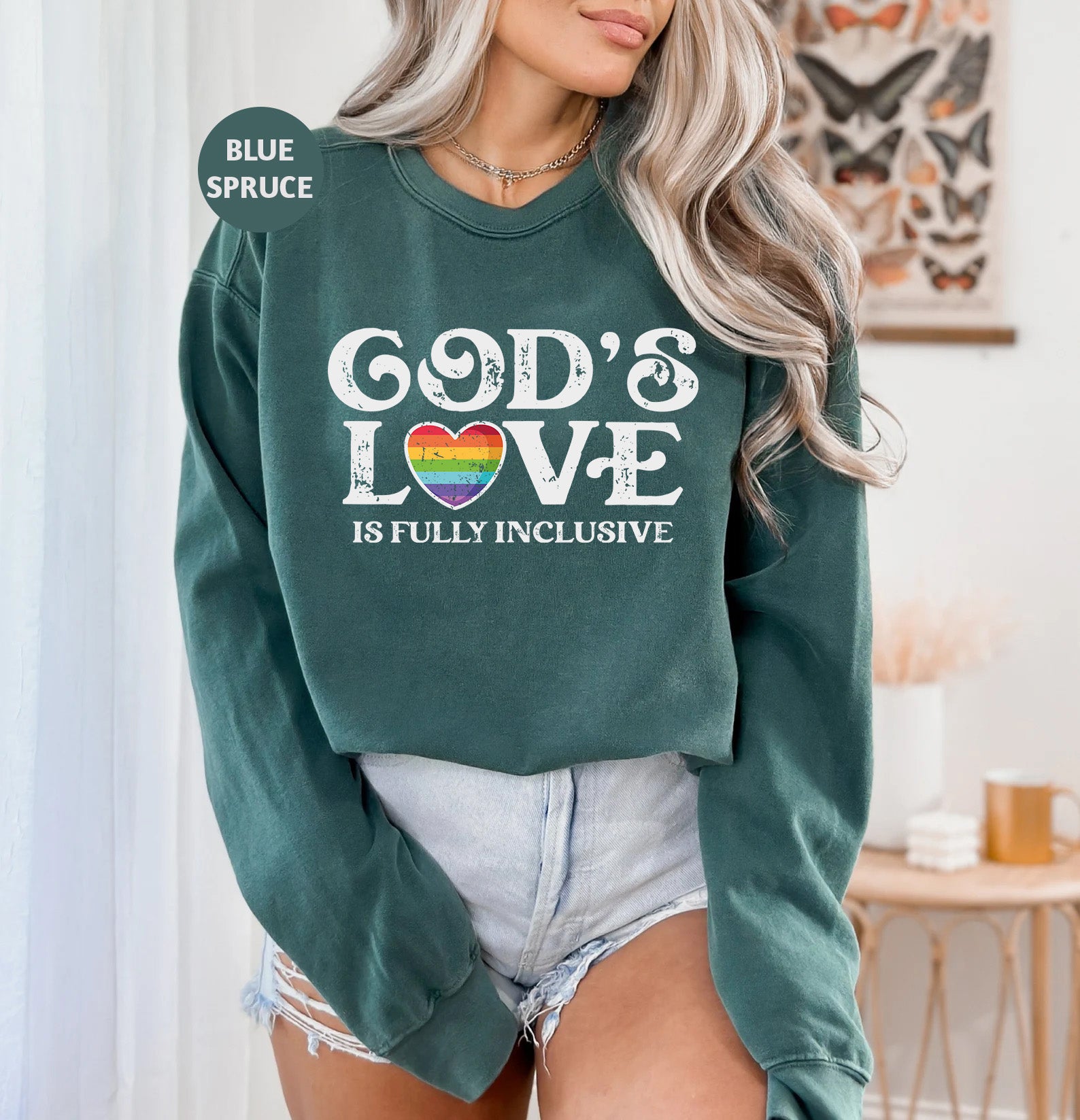 a woman wearing a green sweatshirt with the words god's love on it