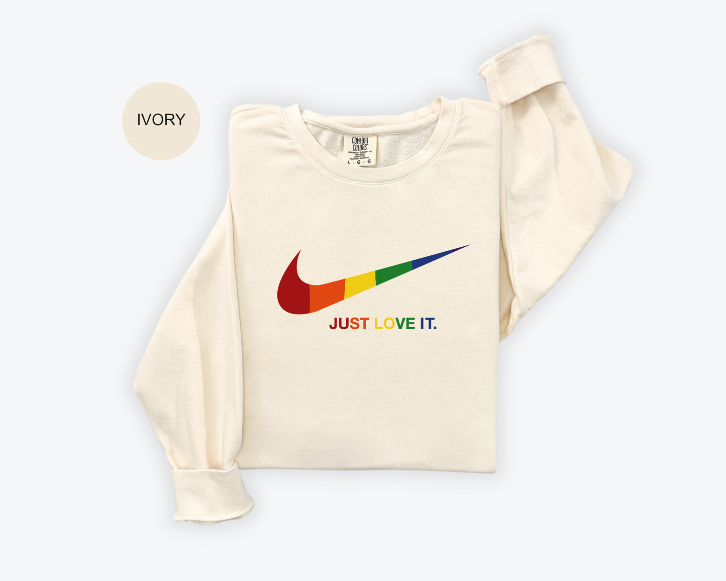 a white shirt with a rainbow nike logo on it