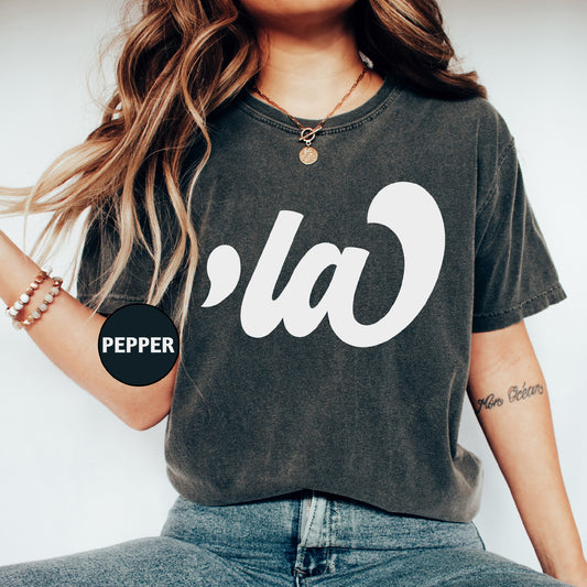 a woman wearing a black shirt with a white logo on it