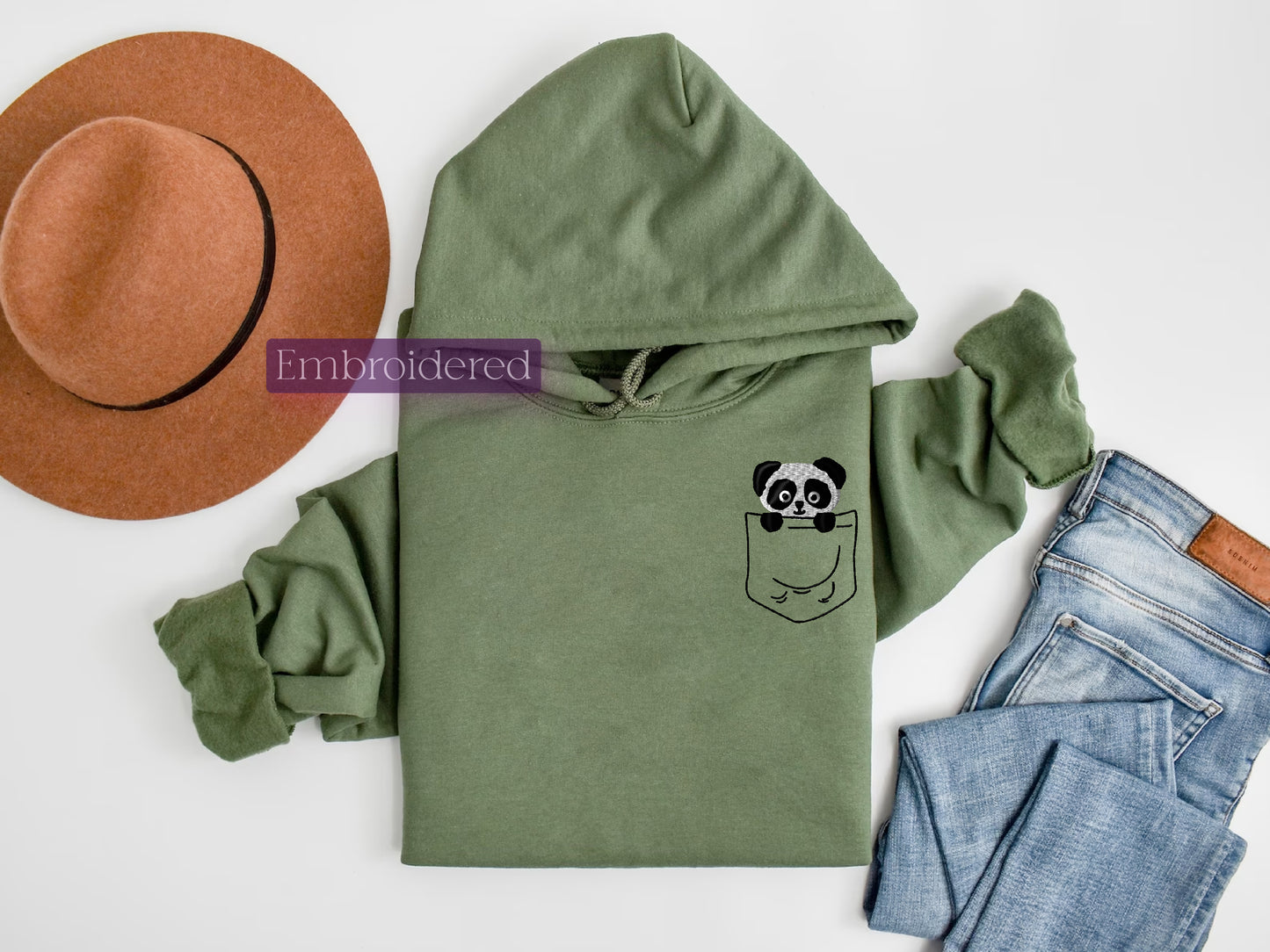 a green hoodie with a panda face on it