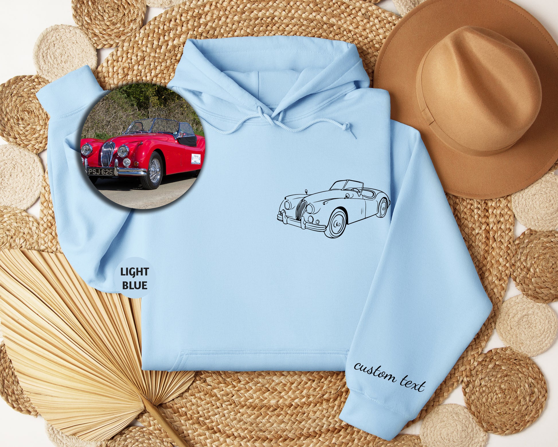 a blue hoodie with a picture of a car on it