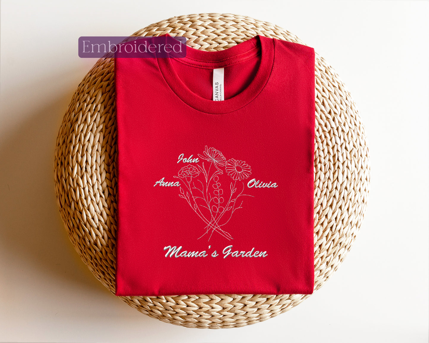 a red t - shirt sitting on top of a wicker basket