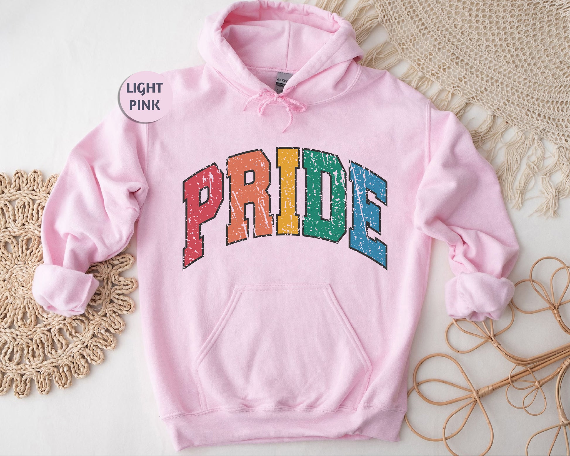 a pink hoodie with the word pride printed on it