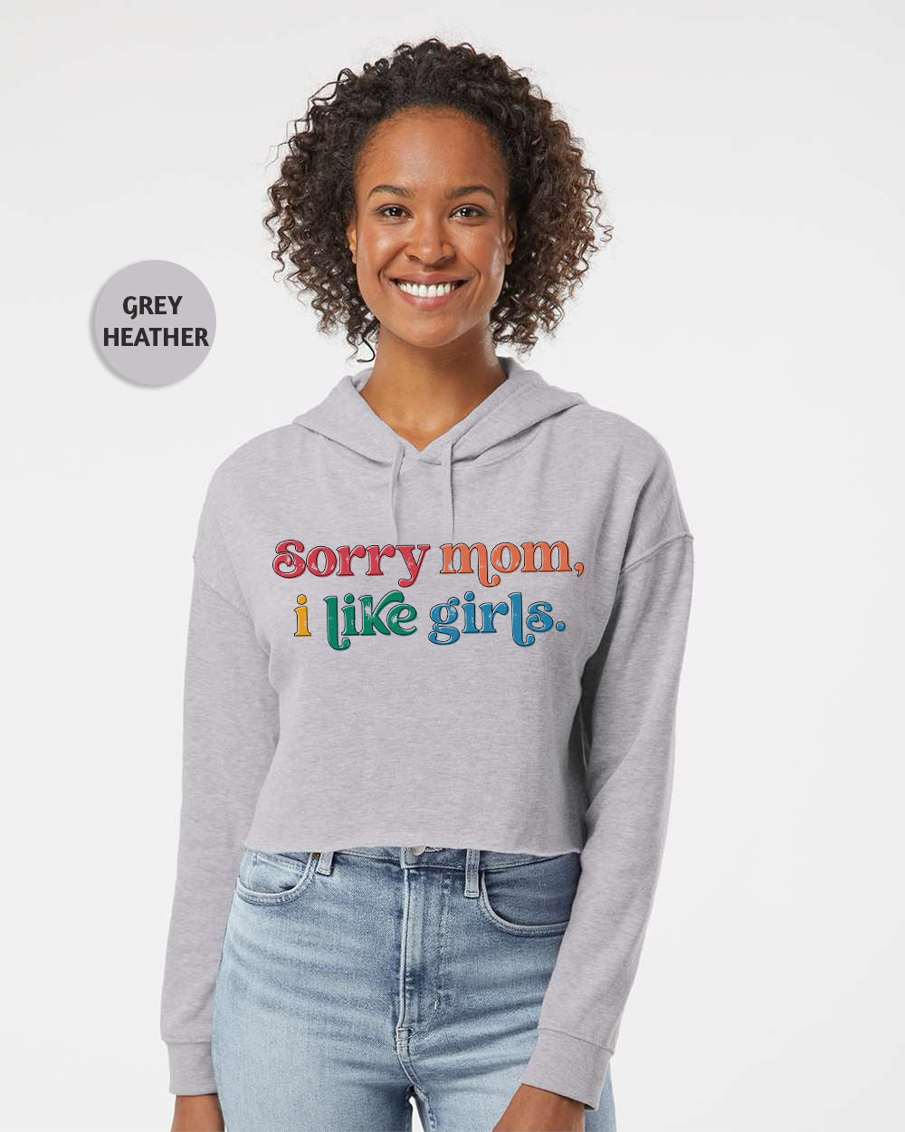 a woman wearing a grey hoodie that says sorry mom, i like girls