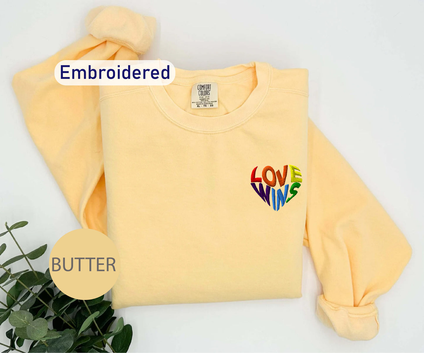 a yellow sweatshirt with the words love is mine on it