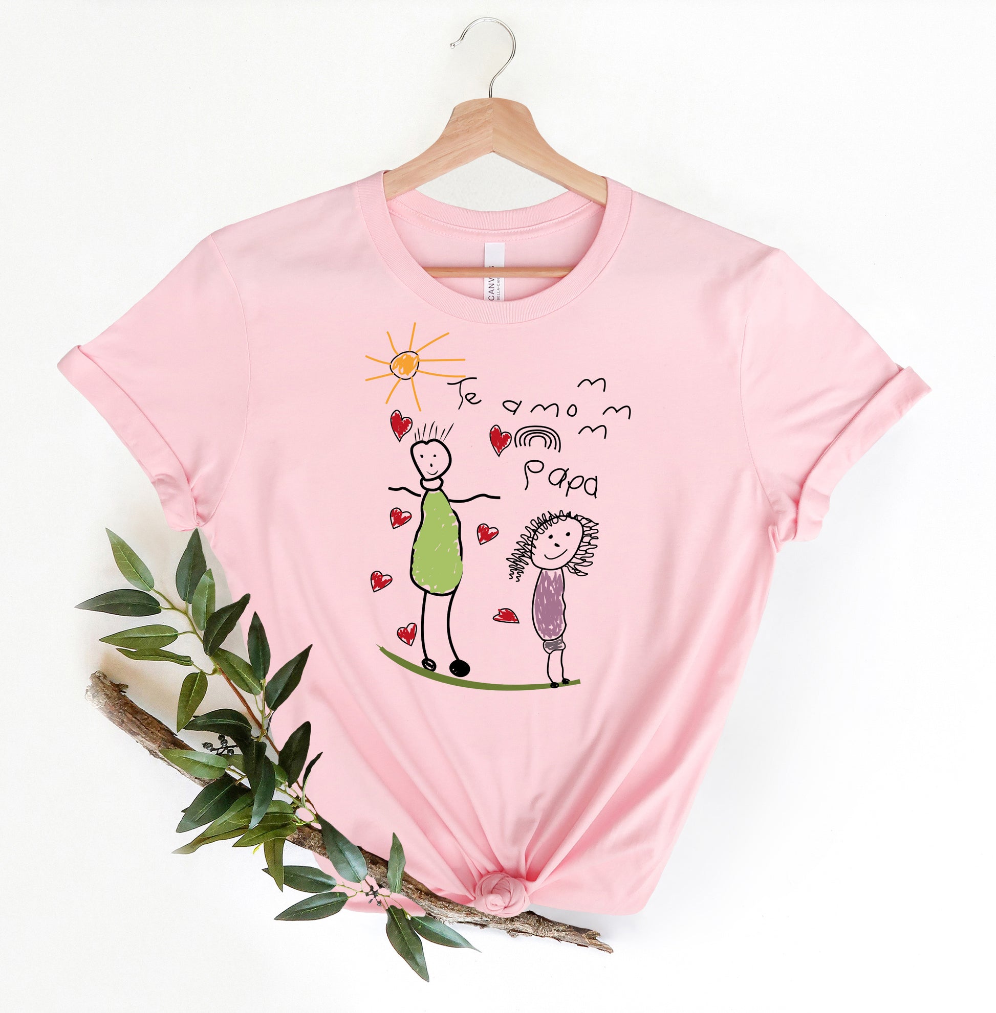 a pink t - shirt with a drawing of a man and a woman on it