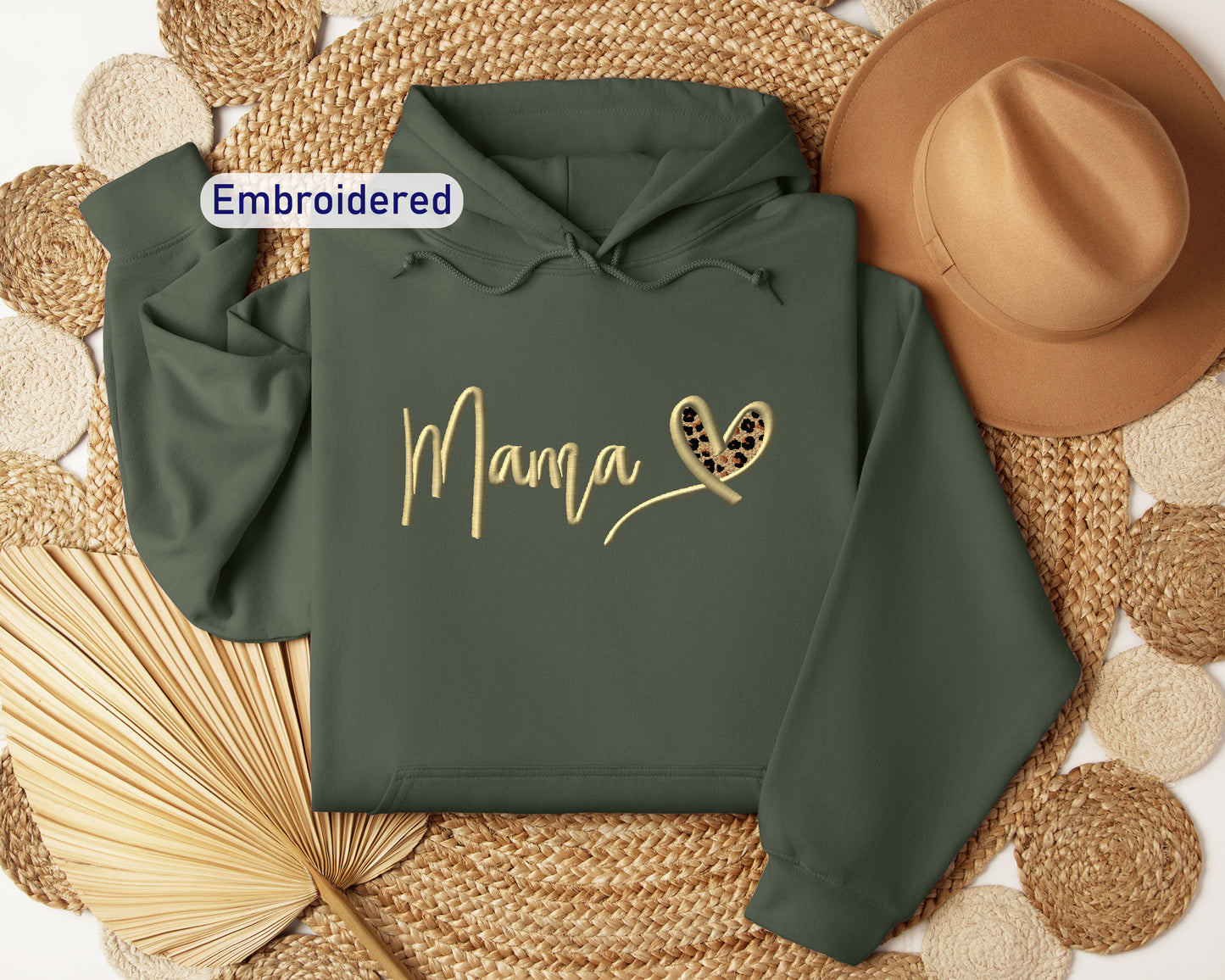 a green hoodie with the word mama printed on it