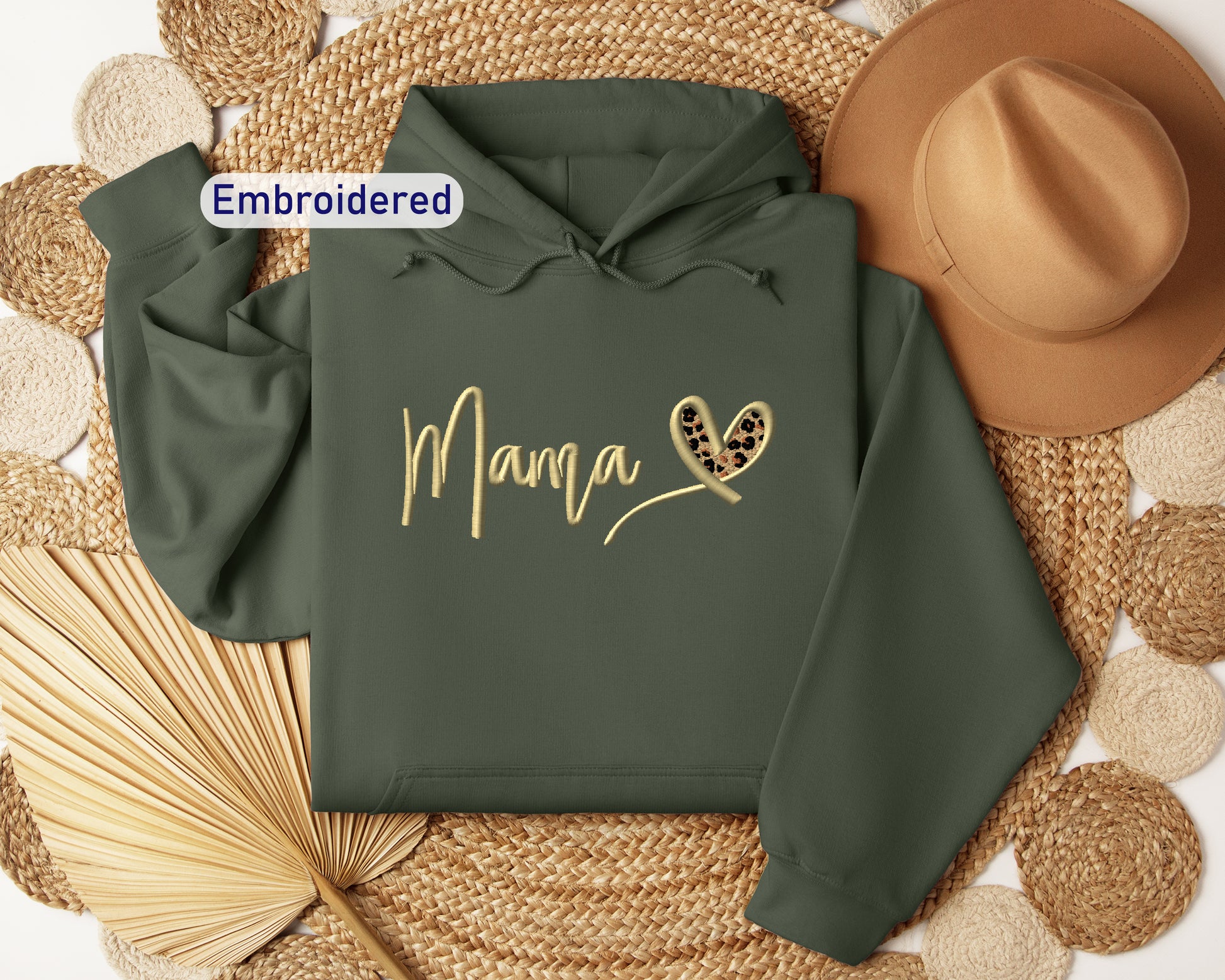 a green hoodie with the word mama printed on it