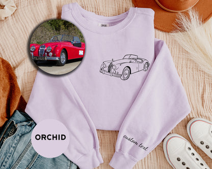 a sweater with a picture of a car on it