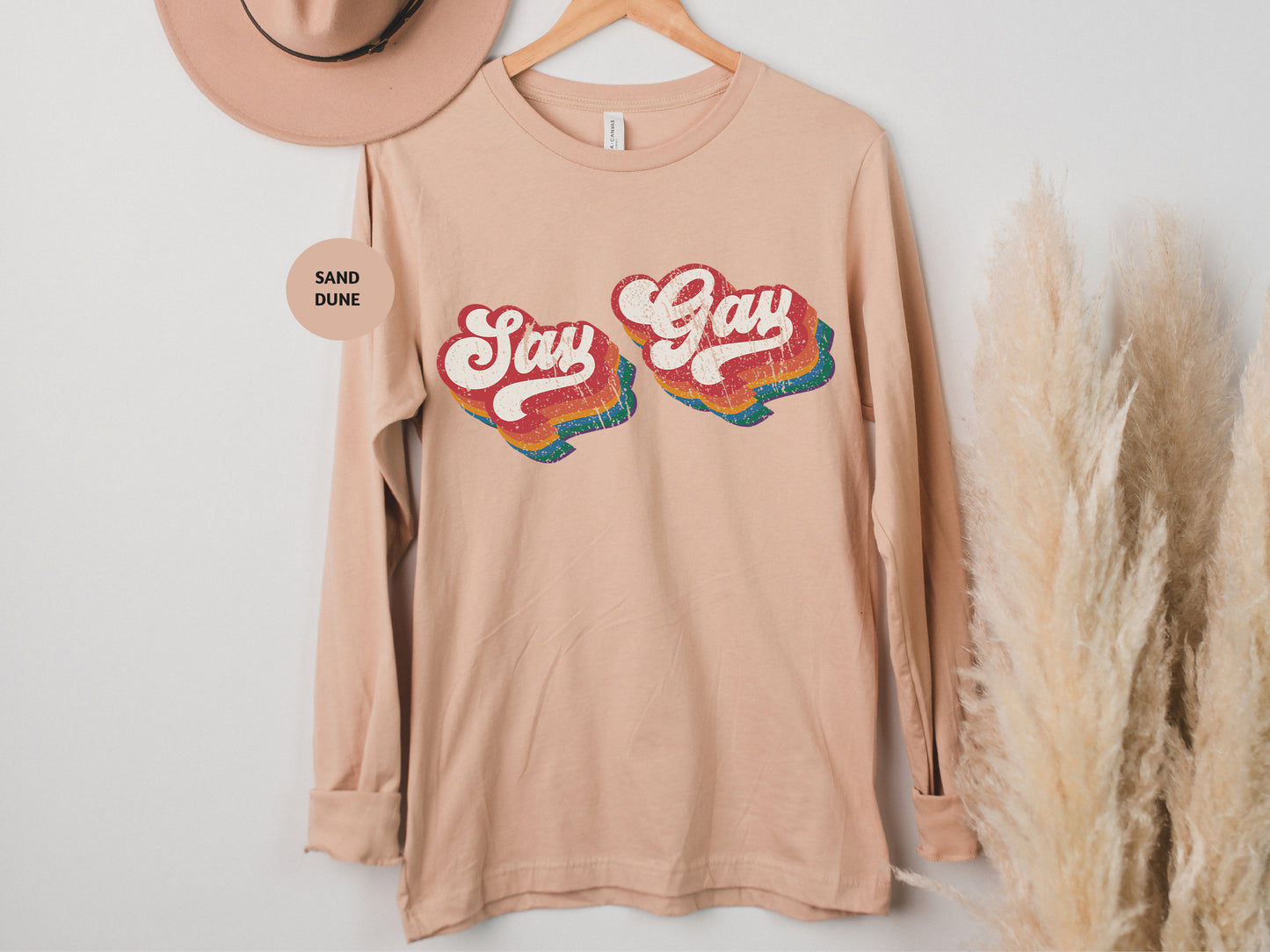 a pink shirt with the words stay gay on it