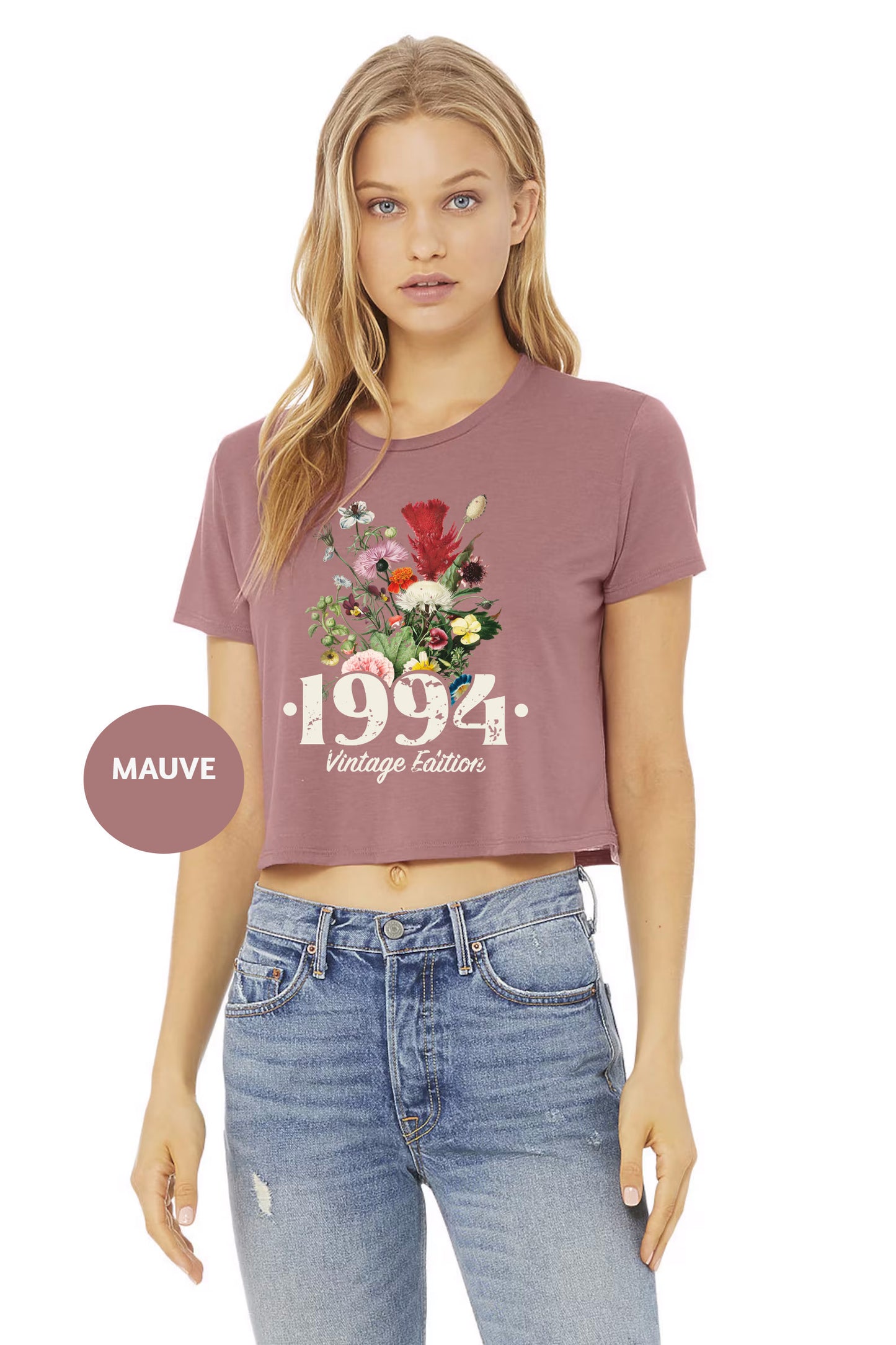 a woman wearing a crop top with flowers on it