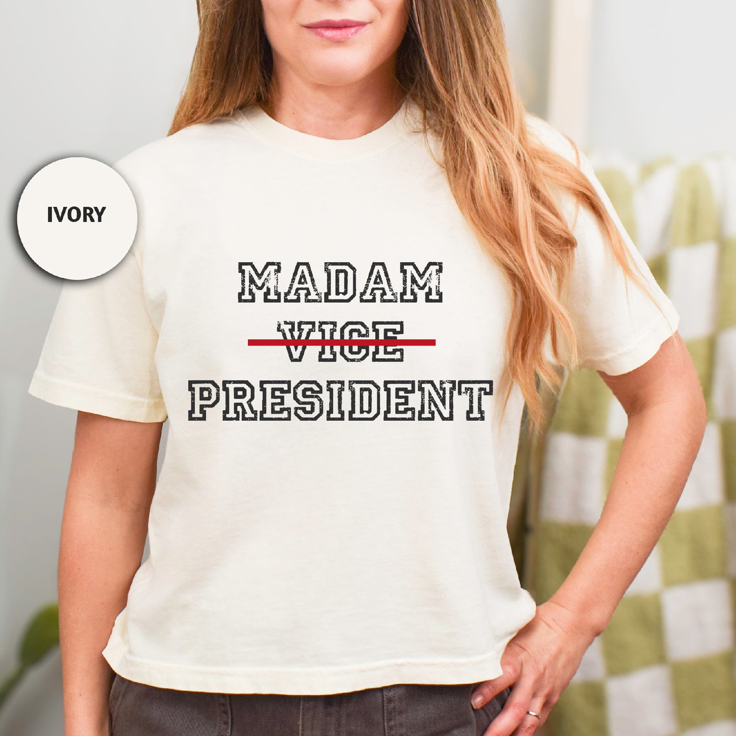 a woman wearing a t - shirt that says madam vice president