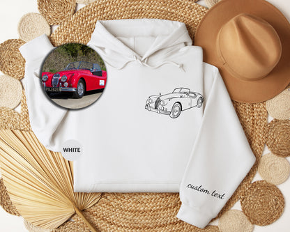 a white hoodie with a picture of a red car on it