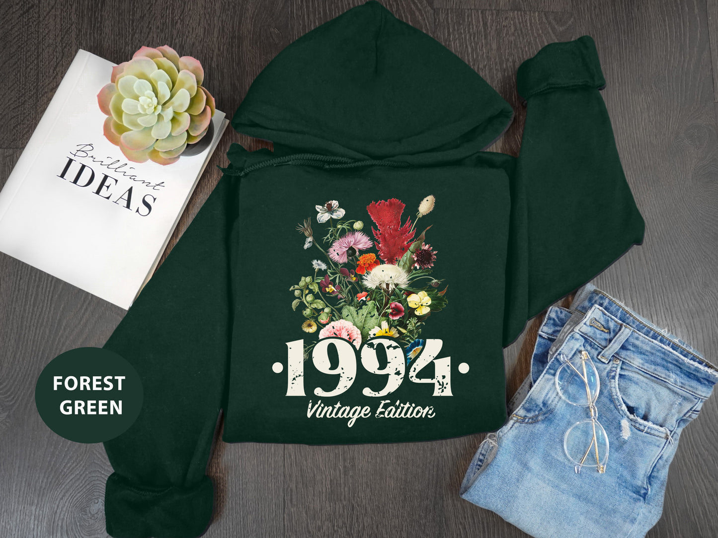 a green hoodie with a picture of flowers on it