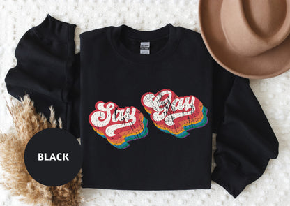 a black shirt with the words stay cozy on it