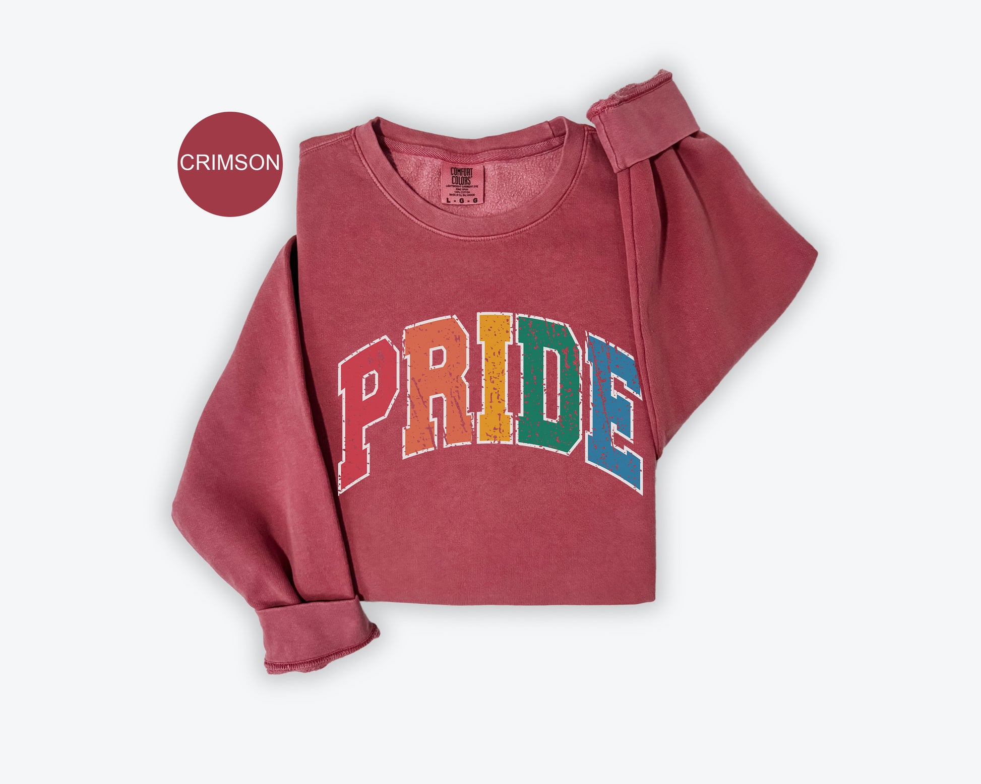 a pink sweatshirt with the word pride printed on it