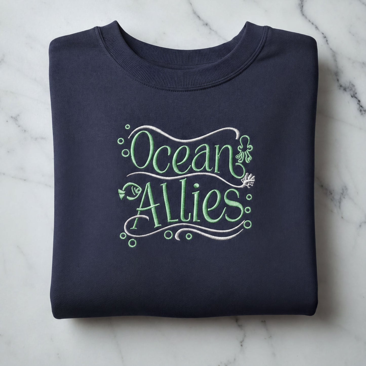 A navy blue sweatshirt with the text "Ocean Allies" embroidered on it.