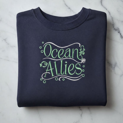 A navy blue sweatshirt with the text "Ocean Allies" embroidered on it.