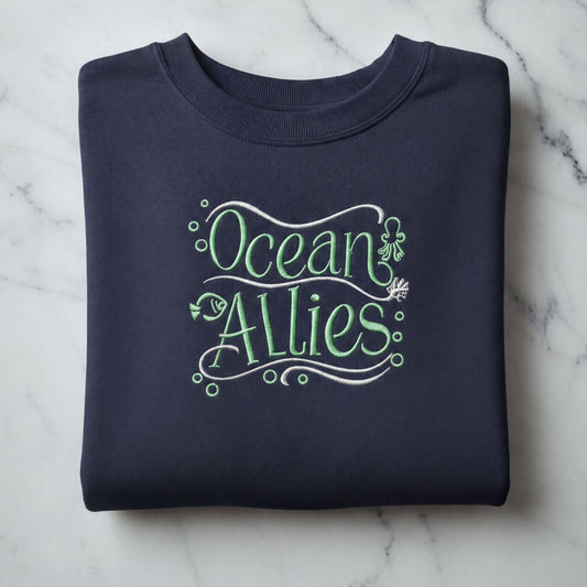 A navy blue sweatshirt with the text "Ocean Allies" embroidered on it.