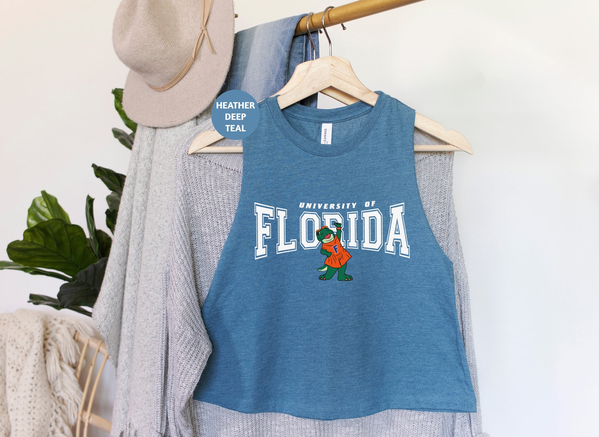 a blue tank top hanging on a clothes rack