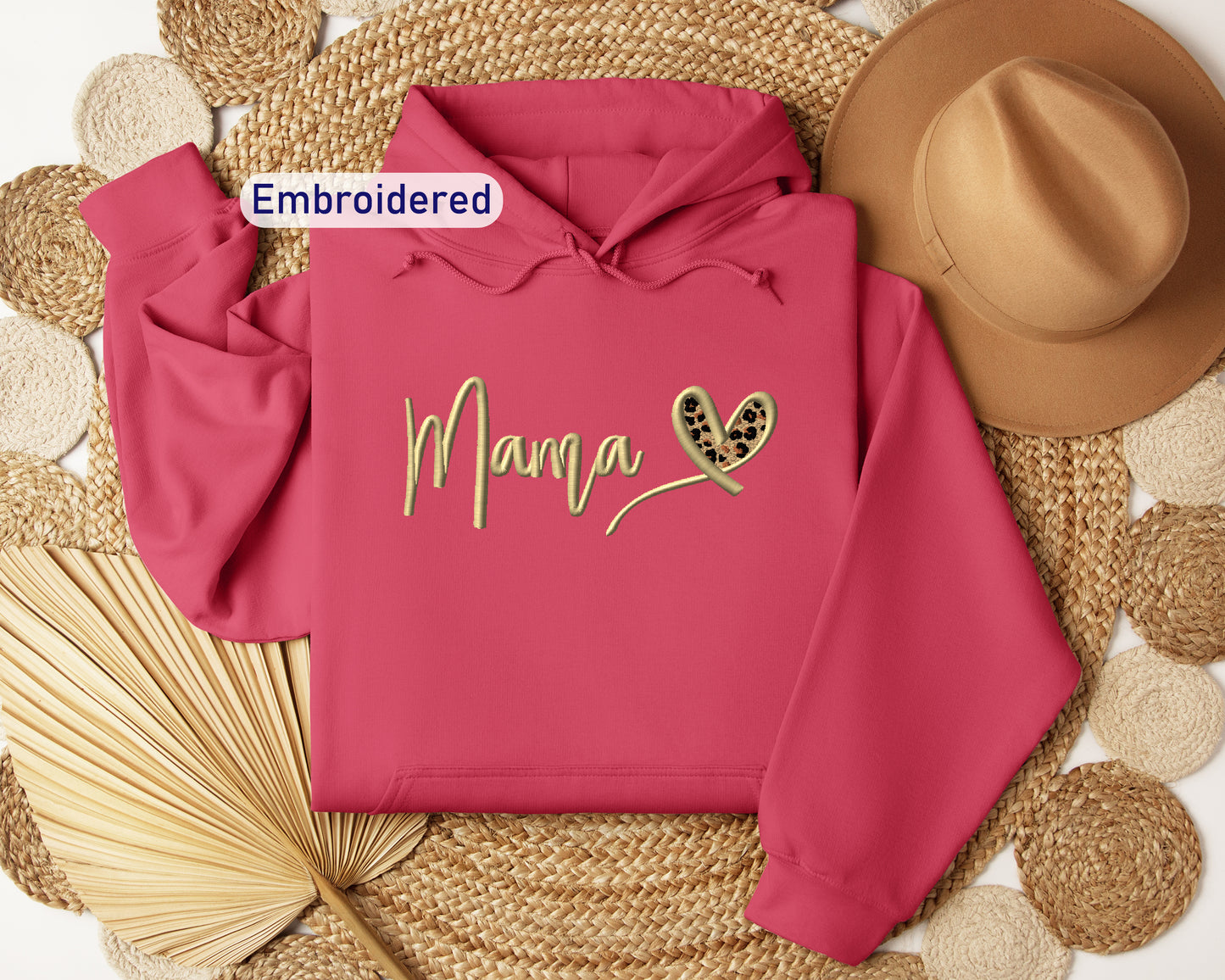 a pink hoodie with the word mama written on it