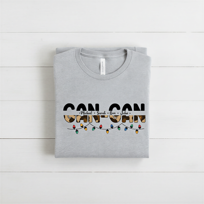 A gray t-shirt with the text "CAN CAN" printed on it, along with a graphic of colorful lights.